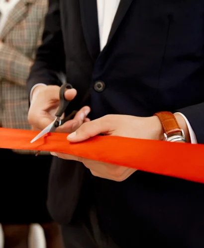 front-view-cutting-red-ribbon-grand-opening-building