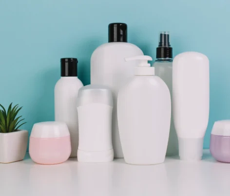 small-plant-near-various-cosmetics-bottles