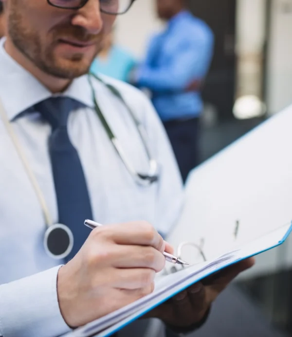 doctor-writing-medical-report